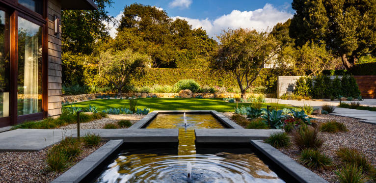 Front yard with modern water fountains