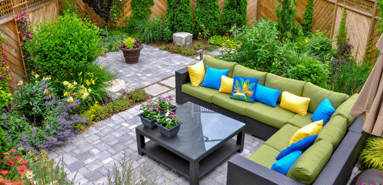 Front yard with colorful outdoor rugs