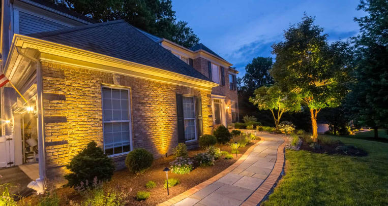 Front yard with outdoor lighting fixtures