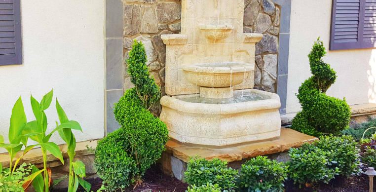 Front yard with garden statues